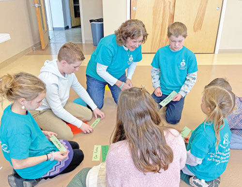 Janine Schorsch strives to share her faith—and touches of hope—as a faith formation teacher for children at St. Teresa Benedicta of the Cross Parish in Bright. (Submitted photo)