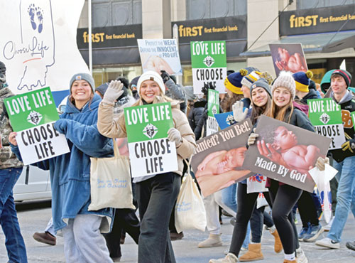 Participants from throughout the state share joy and pro-life messages as they walk along Meridian Street in Indianapolis during the Indiana March for Life on Jan. 22. (Photo by Natalie Hoefer)