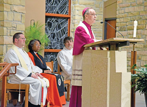 Archbishop Charles C. Thompson gives a reflection during a prayer service for Christian unity held on Jan. 19 at Nativity of Our Lord Jesus Christ Church in Indianapolis. Also taking part in the service are, from left, Father Eric Augenstein, pastor of Nativity Parish, Bishop Jennifer Baskerville-Burrows, shepherd of the Episcopal Diocese of Indianapolis, and Rev. Daniel Forehand of the Indiana-Kentucky Synod of the Evangelical Lutheran Church in America. (Photo by Sean Gallagher)
