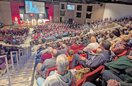 Some 1,500 men taking part in the 10th annual E6 Catholic Men’s Conference on Feb. 22 at East Central High School in St. Leon listen to Father Jonathan Meyer preach during the event’s Mass. (Photo by Sean Gallagher) 