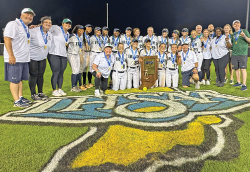 Players, coaches and managers of the girls’ softball team of Cathedral High School in Indianapolis celebrate their Class 3A state championship victory on June 14. (Photo courtesy of Oh Snap Indy)