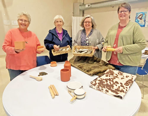 Jane Jolliff, left, Bev Wiwi, Kelly Finch and Dianne Dudley, members of St. Bridget of Ireland Parish in Liberty, pose with items that will be used in the Bethlehem Experience the parish is sponsoring at the Union County 4-H Fairgrounds on Dec. 6. (Submitted photo)