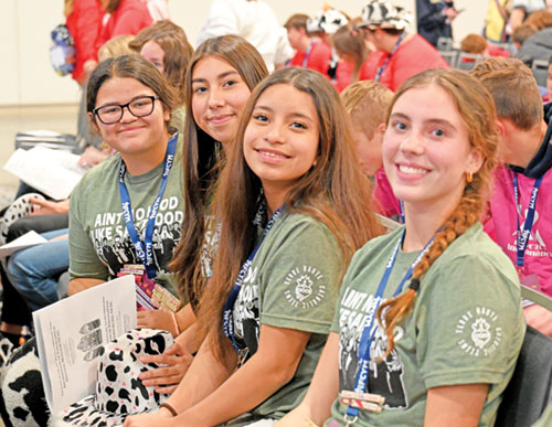 Carmella Marrero, left, Sofia Medina, Lily Morales and Sophia Conner, members of a group from the Terre Haute Deanery, pose on Nov. 20 before an archdiocesan Mass in the Indiana Convention Center in Indianapolis during the National Catholic Youth Conference. (Photo by Natalie Hoefer)