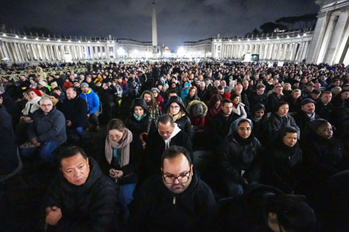 People join Cardinal Luis Antonio Tagle, pro-prefect of the Dicastery for Evangelization, in praying the rosary for Pope Francis in St. Peter's Square at the Vatican Feb. 24, 2025. Other cardinals living in Rome, leaders of the Roman Curia and the faithful joined him for the nighttime prayer. (CNS photo/Lola Gomez)