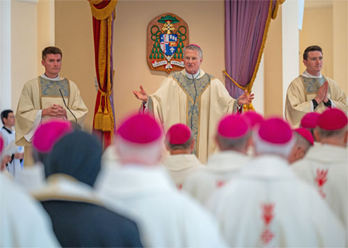 Archbishop Timothy P. Broglio of the U.S. Archdiocese for the Military Services, outgoing president of the U.S. Conference of Catholic Bishops, welcomes his fellow bishops to the Basilica of the National Shrine of the Assumption of the Blessed Virgin Mary in Baltimore Nov. 10, 2025, for the opening Mass of the USCCB's fall plenary assembly. (OSV News photo/Kevin J. Parks, Catholic Review)