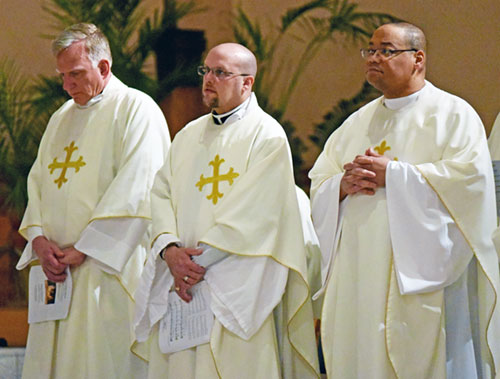 Clergy gather in a church