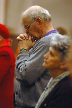George Diehl, a member of Our Lady of the Most Holy Rosary Parish in Indianapolis, prays during the Feb. 11 Mass. (Photo by Sean Gallagher)	
