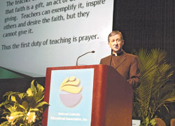 Bishop Blase J. Cupich of Rapid City, S.D., gives a keynote address on March 26 at the 2008 National Catholic Educational Association’s annual convention in Indianapolis. Bishop Cupich spoke to approximately 1,000 convention participants about ways to address a decreasing participation in the life of the Church by many youths and young adults in a presentation titled “Taking Proven Pathways to Face New Challenges.” (Photo by Sean Gallagher) 