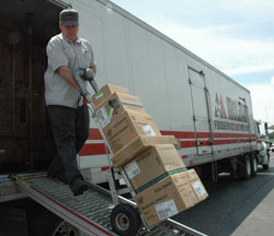 Deacon candidate Dan Collier, a member of St. Malachy Parish in Brownsburg, delivers food items on June 2 to a restaurant in Franklin. Collier has been a truck driver for McLane Food Services for 22 years. (Photo	by Sean Gallagher)	