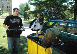 Aaron Foshee, left, a seminarian for the Archdiocese of Oklahoma City studying at Saint Meinrad Seminary and School of Theology in St. Meinrad, helps Archdiocese of Indianapolis seminarian Anthony Hollowell, right, move his belongings into the southern Indiana seminary on Aug. 26. The seminarian enrollment at Saint Meinrad is at a 25-year high this year. (Photo by Sean Gallagher)