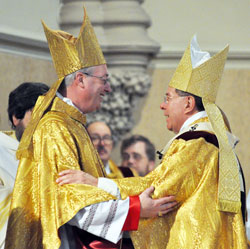 Archbishop Daniel M. Buechlein, right, exchanges a sign of peace with Bishop Christopher J. Coyne after ordaining him an auxiliary bishop on March 2 at St. John the Evangelist Church in Indianapolis. Bishop Coyne’s appointment as auxiliary bishop and Archbishop Buechlein’s early retirement in September were among the top local stories in 2011. (File photo by Mary Ann Garber)