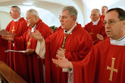 U.S. bishops on their ad limina visits concelebrate Mass in front of the tomb of St. Peter in the crypt of St. Peter’s Basilica at the Vatican on Feb. 9. From left in the first row are Bishop Christopher J. Coyne of Indianapolis; Retired Bishop Gerald A. Gettelfinger of Evansville, Ind.; Archbishop Jerome E. Listecki of Milwaukee; and Bishop Charles C. Thompson of Evansville, Ind. (CNS photo/Paul Haring)