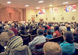 Members of the former St. Bernadette Parish in Indianapolis fill their faith community’s church for Mass on Nov. 23. It was the final parish Mass in the church. Effective on Nov. 30, the parish was merged with nearby Our Lady of Lourdes Parish. The union of the two parishes came about as a result of the Connected in the Spirit planning process. (Submitted photo by Gary Yohler, St. Bernadette Class of 1959)