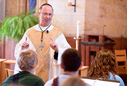Benedictine Archabbot Justin DuVall delivers a homily during a July 11, 2013, Mass in the St. Thomas Aquinas Chapel at Saint Meinrad Seminary and School of Theology in St. Meinrad during the seminary’s One Bread One Cup youth liturgical formation program. The leader of Saint Meinrad Archabbey in St. Meinrad, Archabbot Justin announced on Jan. 13 that he would resign effective on June 2. (Photo courtesy of Saint Meinrad Archabbey)