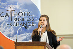 Heidi Smith, director of Catholic Charities Indianapolis’ Refugee and Immigrant Services, talks on Feb. 17 to nearly 70 members of the Catholic Business Exchange on the lives of refugees, the history of refugee resettlement in the United States, and the role of the Church in refugee resettlement in Indianapolis. (Photo by Natalie Hoefer)