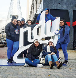 Youths from Holy Spirit Parish in Indianapolis pose for a photo near Monument Circle during a break from the 2017 National Catholic Youth Conference in Indianapolis. In the front row are Narely Vasquez and Karen Rodriguez. In the back row are Behira Salgado, left, Yessica Cruz, Montse Rodriguez, Jaira Salgado, Isenia Rodriguez, and Suyen Salgado. (Submitted photo) 