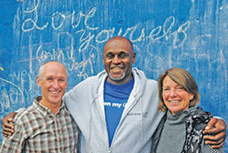 A running program designed to help the homeless transform their lives has connected Whitney Hamilton, center, with Tom and Deb Gardner, members of St. Pius X Parish in Indianapolis, leading them all to a deeper relationship with God. (Photo by John Shaughnessy)