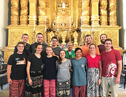 Josh Mears, third from left in the back row, poses with members of his mission team in the church where the incorrupt body of St. Francis Xavier is buried in Goa, India. The mission trip last spring played a large part in Mears, a junior at Indiana University-Purdue University Indianapolis, joining the campus’ Catholic Student Organization. He is a catechumen and will be received into the full communion of the Church this Easter. (Submitted photo)