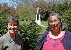Benedictine Sister Sheila Marie Fitzpatrick, left, and Rosemary Spalding pose on the grounds of Our Lady of Grace Monastery in Beech Grove. They are among the members of the archdiocese’s Creation Care Commission. (Photo by John Shaughnessy)