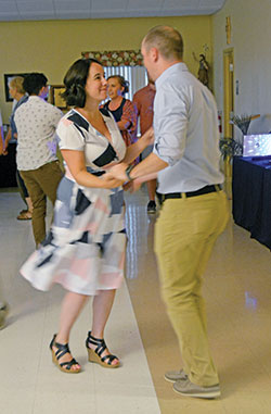Katherine Egan smiles at her husband Justin as he leads her out of a twirl during a marriage event at All Saints Parish in Dearborn County on June 12. The Egans are members of St. Teresa Benedicta of the Cross Parish in Bright. (Photo by Natalie Hoefer)