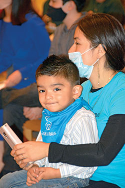 Maribel Aguilar holds her son Alan Santiago during the Respect Life Mass on Oct. 3 at SS. Peter and Paul Cathedral in Indianapolis. They are members of St. Gabriel the Archangel Parish in Indianapolis. (Photo by Natalie Hoefer)