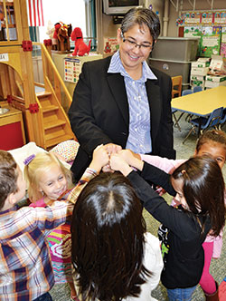Providence Sister Joni Luna is seen in this 2015 photo enjoying time with students of St. Patrick School in Terre Haute where she was an administrator and teacher at the time. On Aug. 14, she professed perpetual vows as a member of the Sisters of Providence of Saint Mary-of-the-Woods. (Submitted photo)