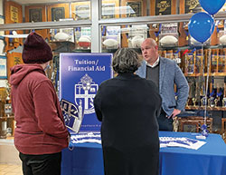Dan Thompson, director of business operations at Bishop Chatard High School in Indianapolis, speaks with visitors at a Nov. 4 open house about tuition assistance options, including Indiana’s newly expanded Choice Scholarship Program. (Submitted photo)