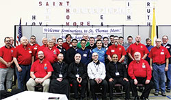 Members of Saint Thomas More Knights of Columbus Council 7431 at St. Thomas More Parish in Mooresville, seminarians at Bishop Simon Bruté College Seminary in Indianapolis and several priests pose for a group photo after the March 28 Seminarian Appreciation Dinner and Priestly Vocations Event. (Submitted photo by Julie Lesh)