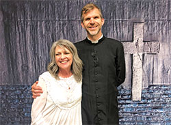 Gayle Griffiths beams with Father Jonathan Meyer, co-pastor of All Saints Parish in Dearborn County, after she was received into the full Communion of the Church during the parish’s Easter Vigil Mass on April 16. (Submitted photo by Cindy White)
