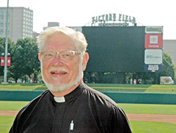 Victory Field in Indianapolis will be the backdrop for Father Rick Ginther as he sings the National Anthem before the Indianapolis Indians’ game on August 4. (Photo by John Shaughnessy)