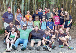 Youths from several parishes, including St. Michael in Bradford and St. Bernard in Frenchtown, enjoy a day at the Cincinnati Zoo after participating in a mission trip. Deacon John Jacobi, director of religious education and youth ministry for both parishes, is standing at far left in the back row. (Submitted photo)