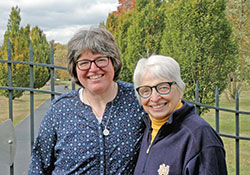 The friendship between Benedictine Sister Susan Reuber, left, and Sister Mary Luke Jones reflects one of the defining qualities of Our Lady of Grace Monastery in Beech Grove—the tight bonds that connect sisters across the generations. (Photo by John Shaughnessy)