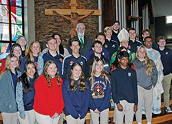 Archbishop Charles C. Thompson joins the seniors of Seton Catholic High School in Richmond for a photo following the archbishop’s annual Mass with high school seniors from Catholic schools across the archdiocese on Oct. 26 at St. Malachy Church in Brownsburg. (Photo by John Shaughnessy)