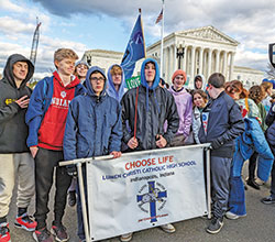 Students from Lumen Christi Catholic High School in Indianapolis stand on Jan. 20 in front of the U.S. Supreme Court in Washington while participating in the March for Life. (Photo by Sean Gallagher)