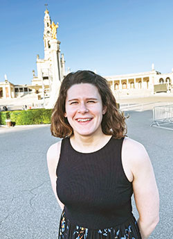 Emily Mastronicola poses in front of the Shrine of Our Lady of Fatima in Portugal where she visited on March 29 as part of her advance scouting trip for the nearly 200 young people from the archdiocese who will be attending World Youth Day with Pope Francis in that European country on Aug. 1-6. (Submitted photo)