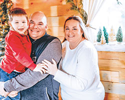 Jessica and Kevin Murphy smile with their son Daniel in December 2022. She was recently named one of Terre Haute’s “12 Under 40” professionals who have made significant contributions to the community. (Submitted photo)