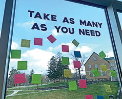 On a window outside the Unified Media Center at Cathedral High School in Indianapolis, members of the school’s Empowering Healthy Minds Club stick Post-it notes for affirmation and encouragement. (Submitted photo)