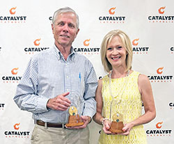 Jon Train, left, and Donna Curry pose with the St. John Bosco awards they received during the Catalyst Catholic Gala held on Aug. 26 at Huber’s Orchard & Winery in Borden. Catalyst Catholic is the office of youth ministry in the New Albany Deanery. (Submitted photo by Catalyst Catholic’s CJ Smith intern, Annika Martin)