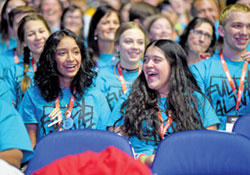 Teens from the Diocese of Gary, Ind., laugh on Nov. 18 during the homily of the closing Mass of the National Catholic Youth Conference in Lucas Oil Stadium in Indianapolis. (Photo by Sean Gallagher)