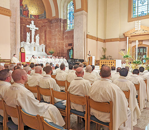 Priests serving across central and southern Indiana listen on March 26 to Archbishop Charles C. Thompson preaching a homily at the annual archdiocesan chrism Mass. (Photo by Sean Gallagher)