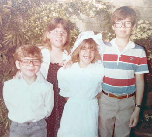 Taken 40 years ago, a photo captures Jen Inglish Wetherell on the day of her first Communion, joined in the photo by her siblings, David Inglish, left, Megan Inglish and Robert Inglish. (Submitted photo)