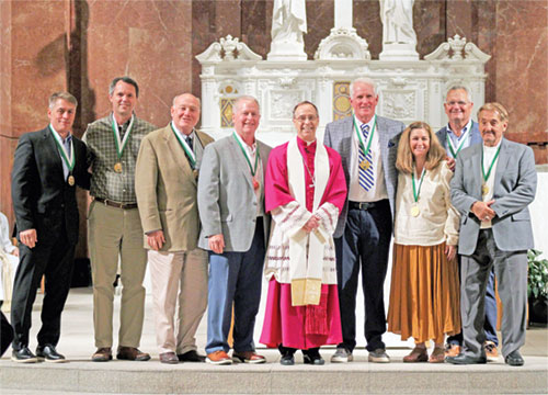 Archbishop Charles C. Thompson poses for a photo with the recipients of the St. John Bosco Award, the highest honor given by the archdiocese’s Catholic Youth Organizations. The honorees are Kevin Sowinski, left, Thomas O’Gara, Dennis Southerland, Jerry Ross, Edward Tinder, Antoinette Maio Burford, John Gause and Frankie Medvescek. (Submitted photo)