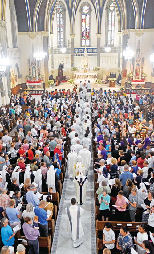 Numerous priests and several bishops, including Archbishop Charles C. Thompson, process into St. John the Evangelist Church in Indianapolis on July 16 for a Mass celebrating the arrival of the four National Eucharistic Pilgrimage routes at the church. (Photo by Natalie Hoefer)