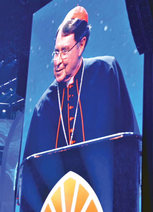An image of United States papal nuncio Cardinal Christophe Pierre is projected on a large screen as he speaks on July 17 in Lucas Oil Stadium in Indianapolis during the first evening revival session of the National Eucharistic Congress. (Photo by Natalie Hoefer)