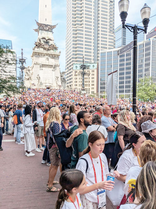 People of all ages and backgrounds packed the sidewalks of downtown Indianapolis on July 20 to watch a eucharistic procession honoring Christ in the Blessed Sacrament weave from the Indiana Convention Center to the Indiana War Memorial. (Submitted photo by Andrew Motyka)