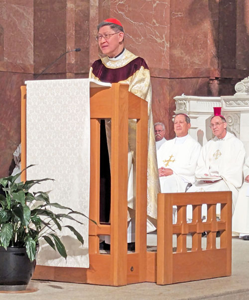 Cardinal Antonio Tagle, pro-prefect of the Vatican’s Dicastery for the Evangelization of Peoples, preaches during a Mass with 800 Filipino Catholics at SS. Peter and Paul Cathedral in Indianapolis. Six bishops, including Archbishop Charles C. Thompson, right, concelebrated, along with 40 priests. (Photo by Sean Gallagher)
