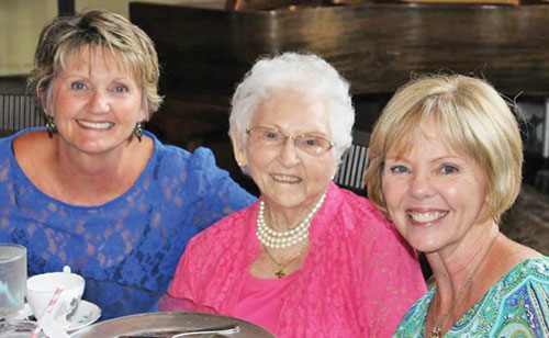 Pam Ryker, left, and Connie Covert share a moment of joy with their mother, Genny Evans. (Submitted photo)