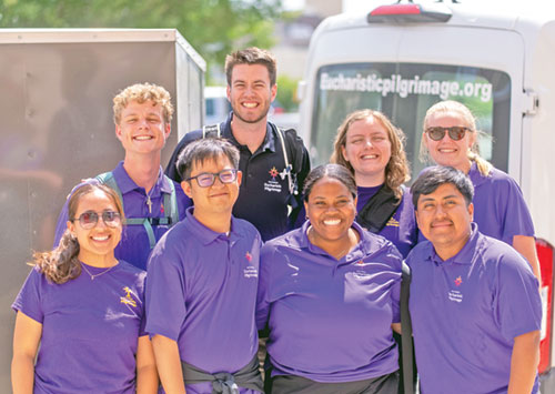 The young adult pilgrims who recently made the 3,300-mile National Eucharistic Pilgrimage from Indianapolis to Los Angeles show their joy for the journey. In the front row are Leslie Reyes-Hernandez, left, Ace Acuña, Cheyenne Johnson and Johnathan Silvino Hernandez. In the back row are Stephen Fuhrmann, left, Charlie McCullough, Rachel Levy and Frances Webber. (Photo contributed by the National Eucharistic Congress)