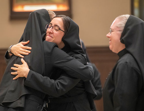 Mercy Sister Maria Guadalupe Figueroa receives with joy the congratulations of a fellow member of the Religious Sisters of Mercy of Alma, Mich., during an Aug. 16 Mass at the Cathedral of Mary of the Assumption in Saginaw, Mich., in which Sister Maria Guadalupe professed final vows as a member of the Sisters of Mercy. She grew up as a member of St. Anthony Parish in Indianapolis. (Submitted photo)
