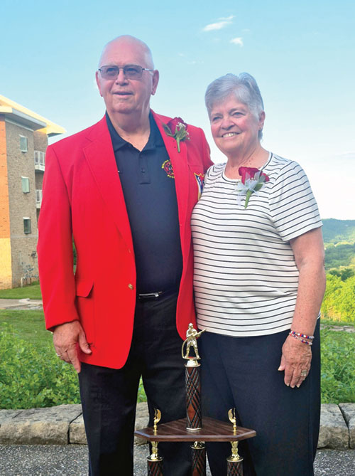 Larry and Martha Tempel of Annunciation Parish in Brazil pose in Madison in June after he was named Mr. IVFA—the Indiana Volunteer Firefighters Association’s highest honor—during the organization’s convention. The red jacket is a traditional part of the honor. For 53 years, the Tempels have served in numerous ways to better their community. (Submitted photo)